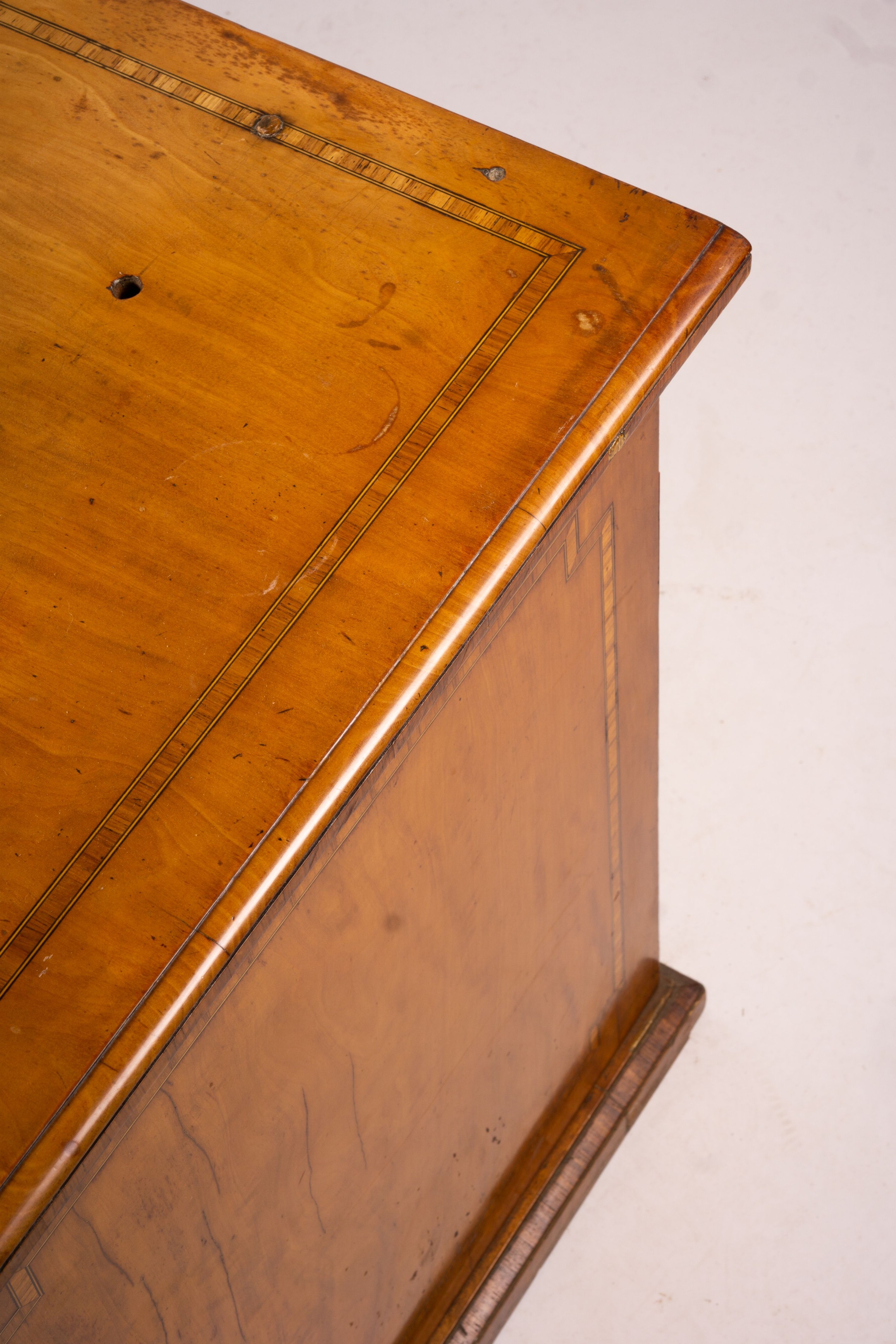 A late Victorian banded satinwood kneehole desk, width 138cm, depth 67cm, height 71cm